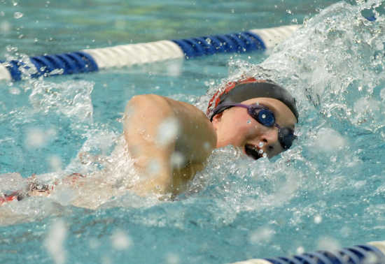 Jackson's Jenny Powell swims in the fifth heat of the 50 yard freestyle 