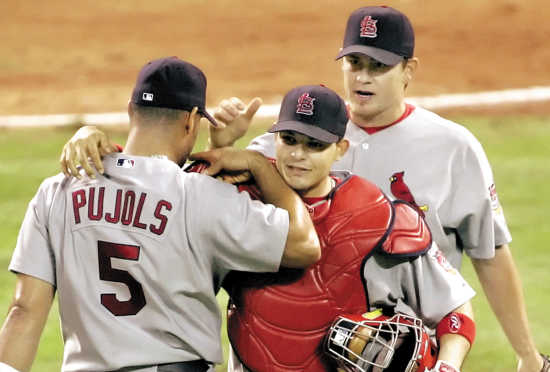 St. Louis Cardinals slugger Albert Pujols (L) talks with NBA star Shaquille  O'Neal while visiting batting practice at Busch Stadium in St. Louis on  August 11, 2009. Shaquille O'Neal is in St.