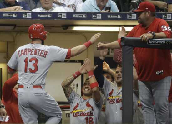 St. Louis Cardinals' Matt Carpenter celebrates after hitting a solo home  run during the seventh inning in the second game of the team's baseball  doubleheader against the Milwaukee Brewers on Tuesday, June