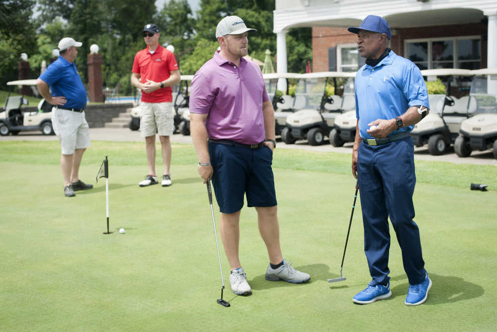 SOMO athletes welcome golfers at Ozzie Smith's golf tournament