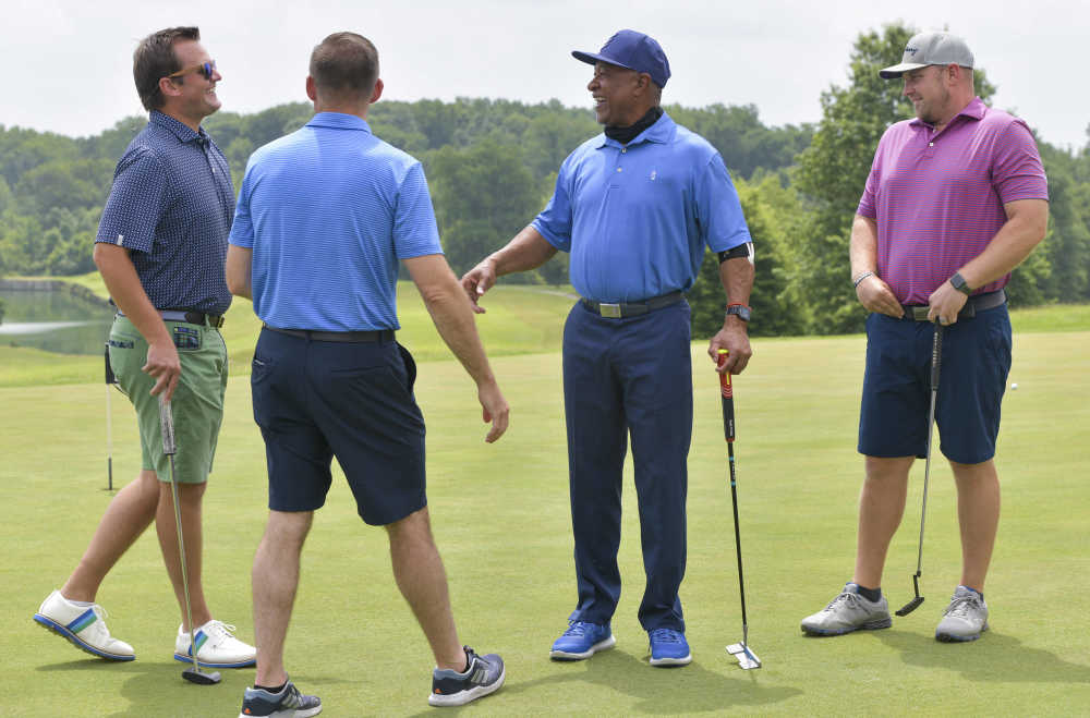 SOMO athletes welcome golfers at Ozzie Smith's golf tournament