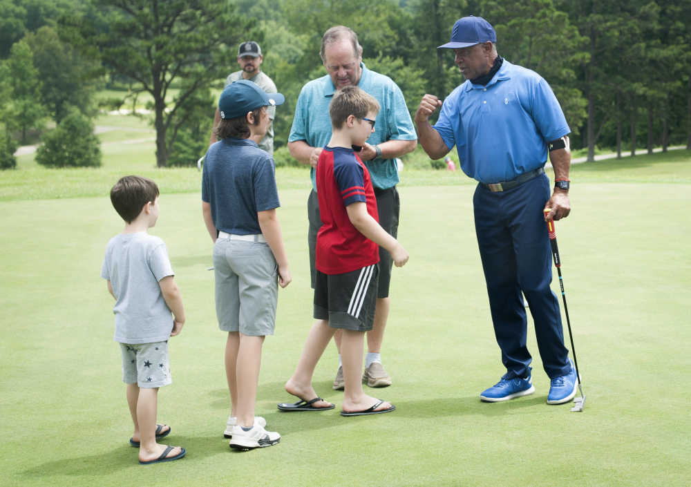Cardinals legend Smith plays a round with lake golf pros
